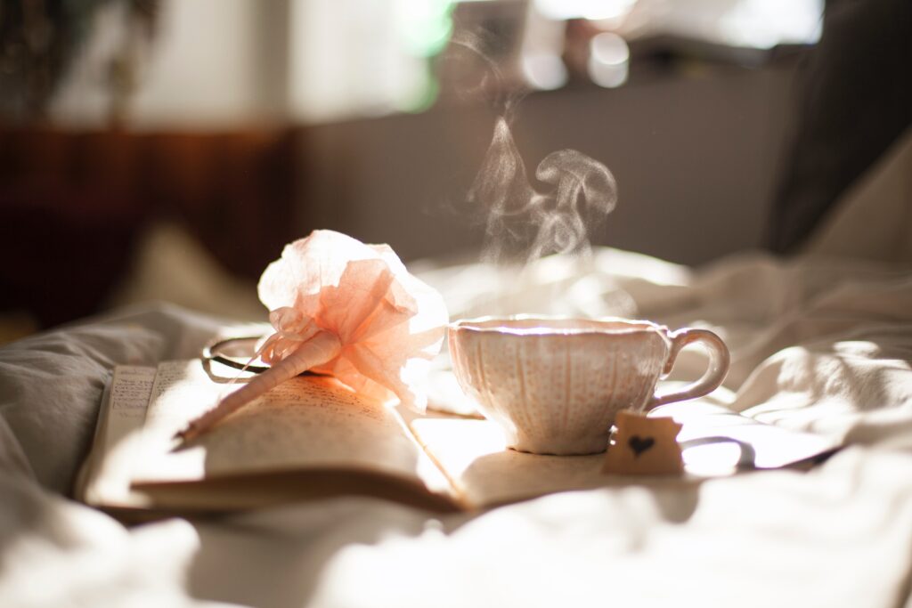 chamomile manzanilla tea cup on journal