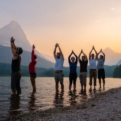 group yoga in lake at sunset for the manzanilla sophia blog